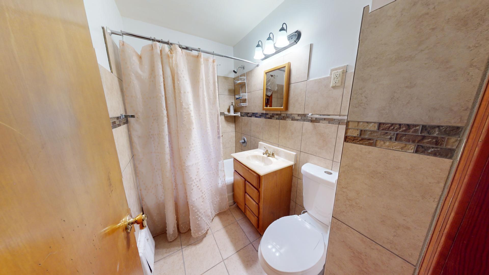 4377 Kentucky Street Gary, IN 46409 - Photo 11 of 20 a bathroom with a sink toilet and shower
