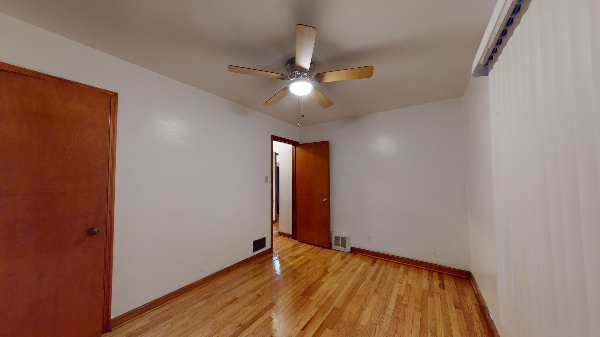 4377 Kentucky Street Gary, IN 46409 - Photo 13 of 20 wooden floor in an empty room
