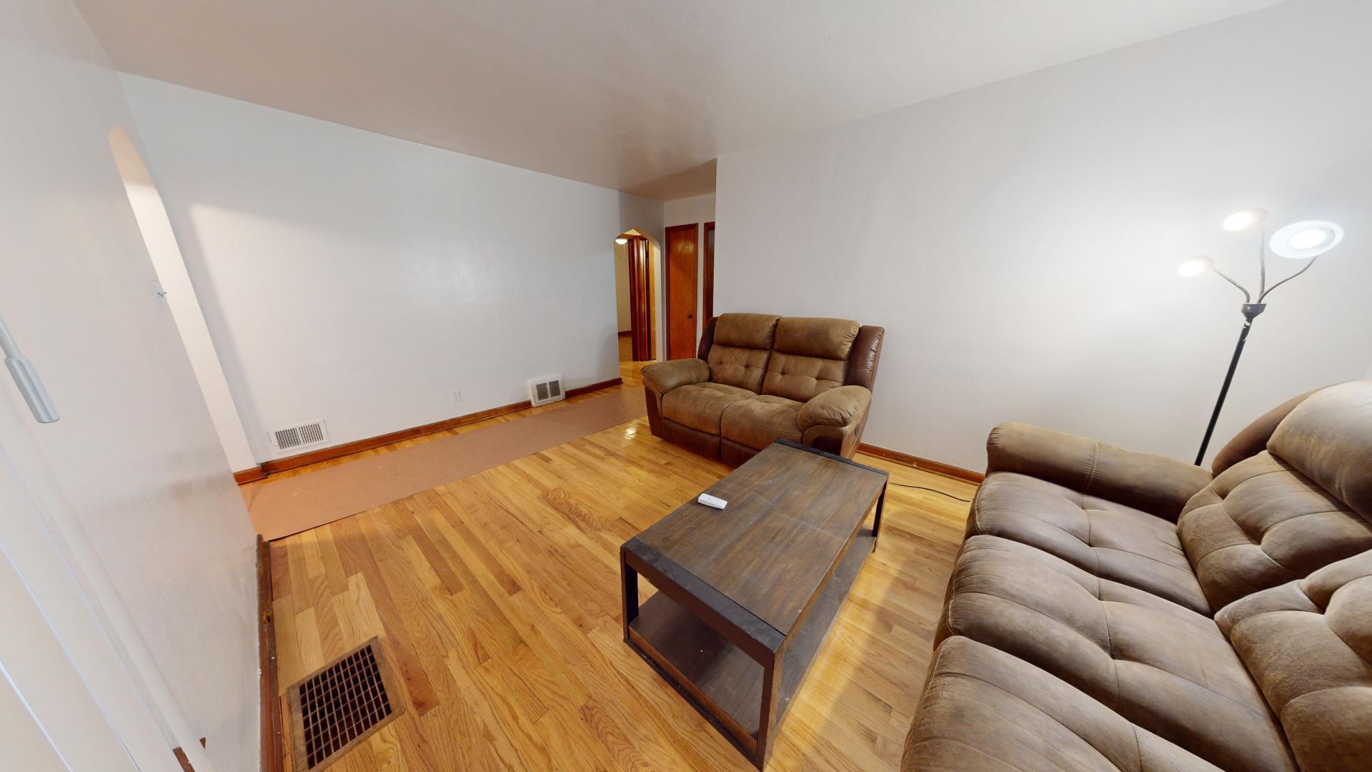 4377 Kentucky Street Gary, IN 46409 - Photo 3 of 20 a living room with furniture and a wooden floor