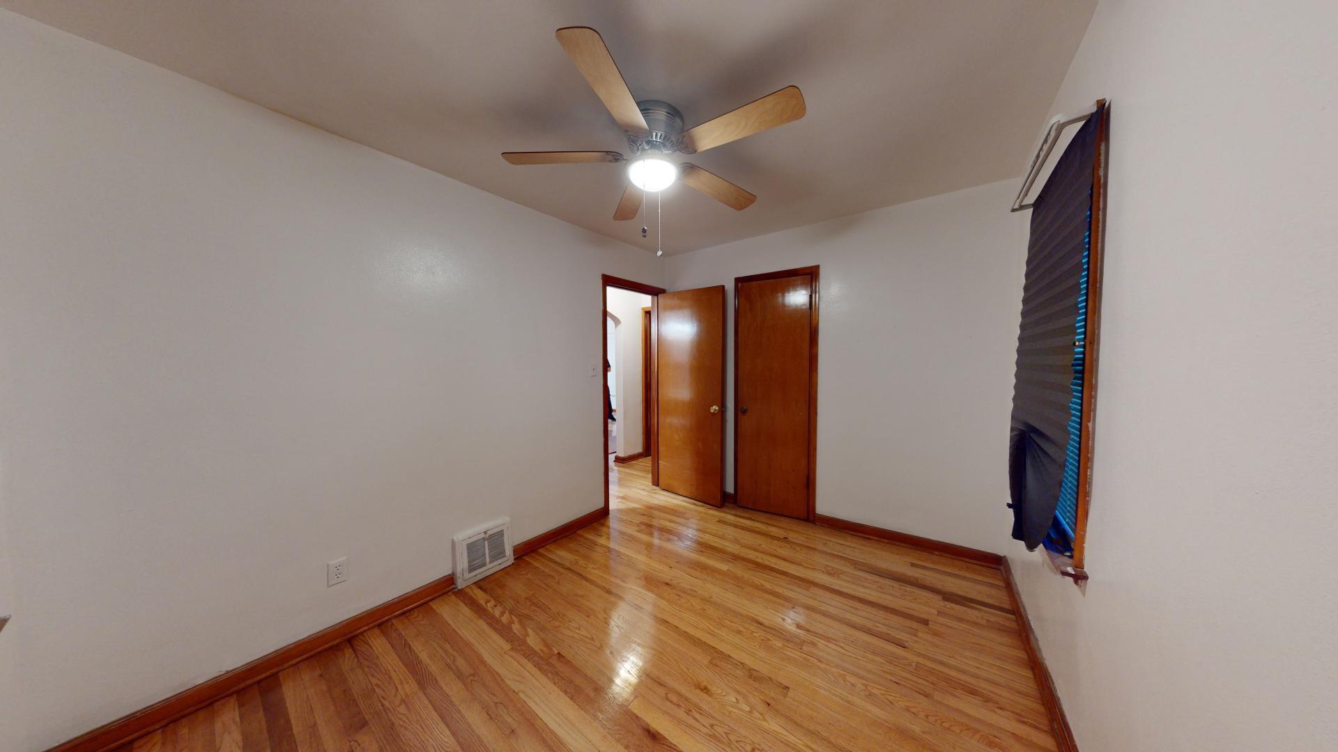 4377 Kentucky Street Gary, IN 46409 - Photo 9 of 20 a view of an empty room with wooden floor