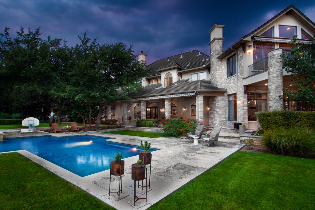 628 Brandon Way Austin, TX 78733 - Photo 1 of 1 a front view of a house with swimming pool garden and patio