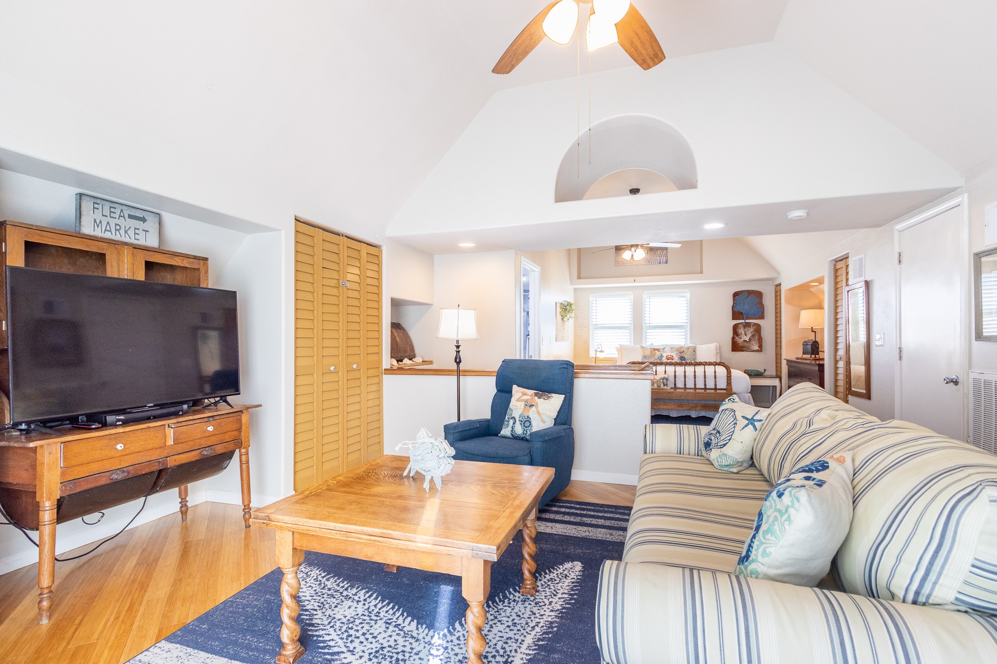 16518 Jean Lafitte Road Jamaica Beach, TX 77554 - Photo 15 of 43 a living room with furniture and a flat screen tv