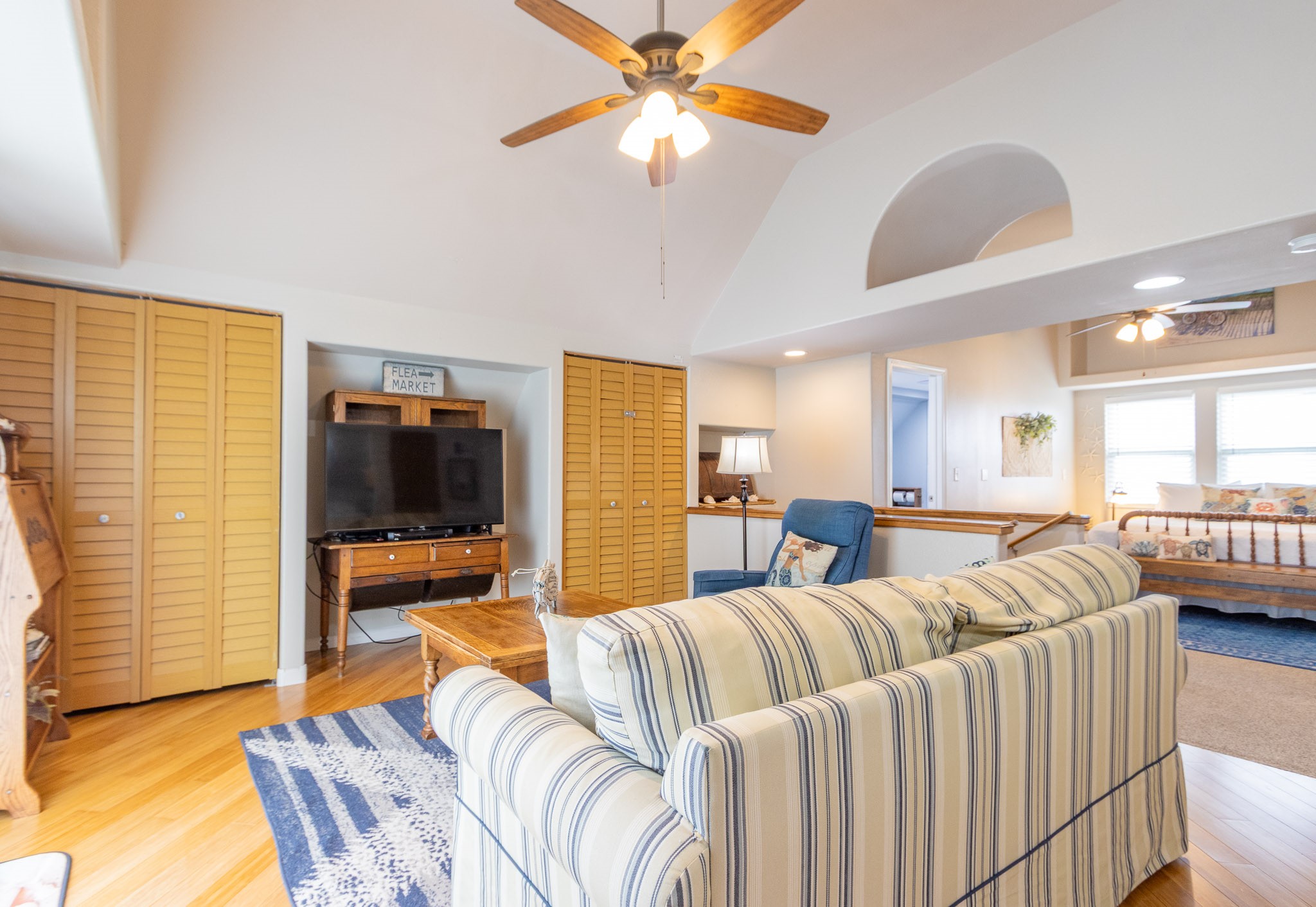 16518 Jean Lafitte Road Jamaica Beach, TX 77554 - Photo 16 of 43 a living room with furniture and a flat screen tv