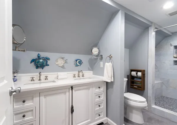 a bathroom with a sink a toilet and vanity