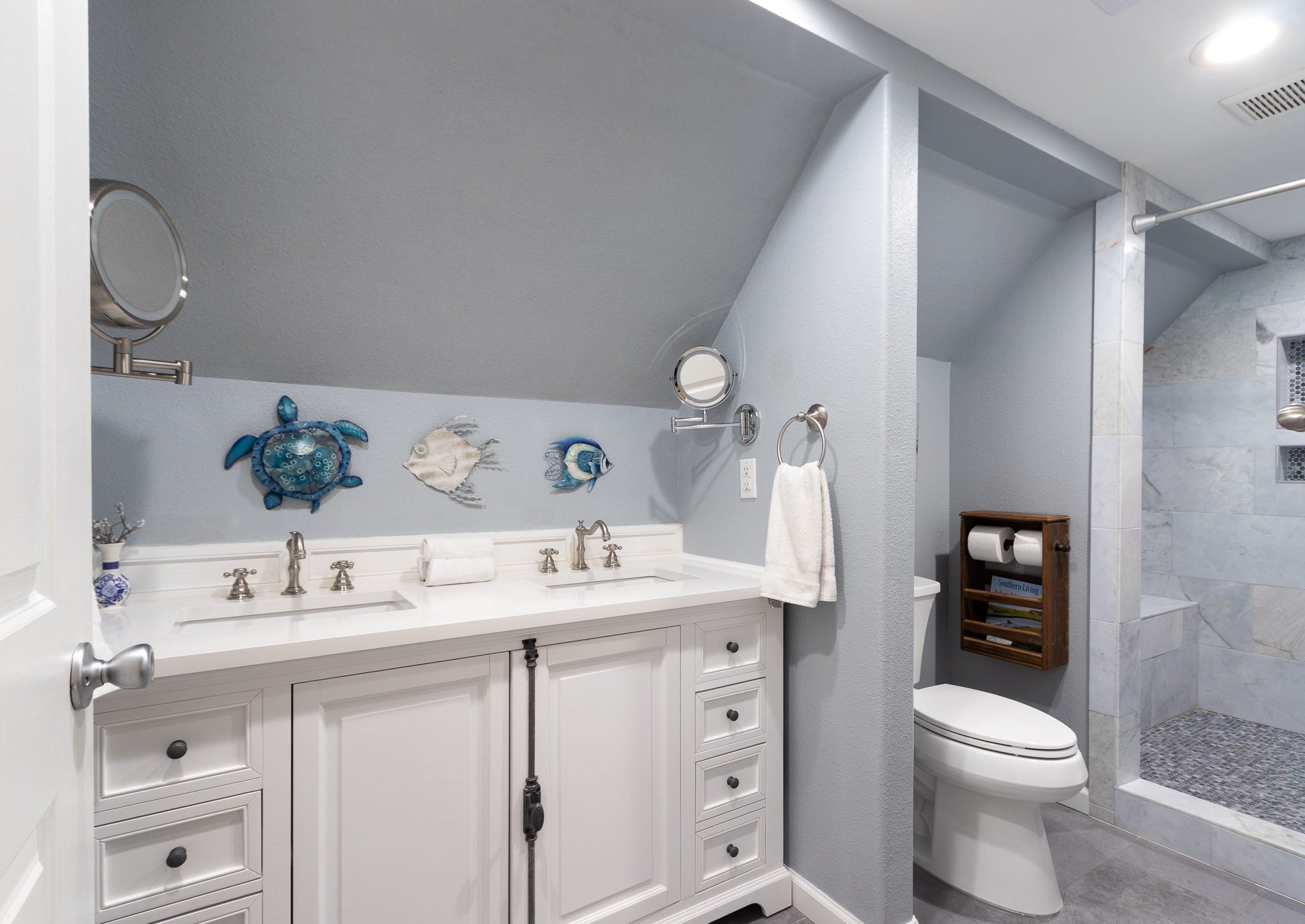 16518 Jean Lafitte Road Jamaica Beach, TX 77554 - Photo 20 of 43 a bathroom with a sink a toilet and vanity