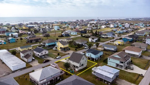 an aerial view of a city with lots of residential buildings