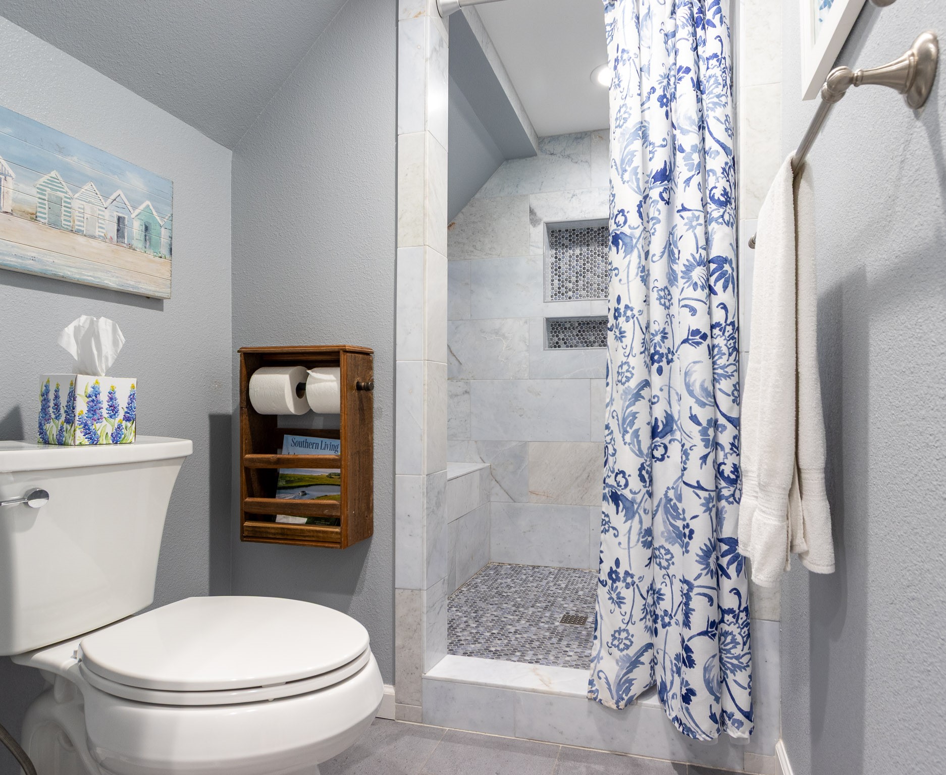 16518 Jean Lafitte Road Jamaica Beach, TX 77554 - Photo 22 of 43 a white toilet sitting next to a bathroom