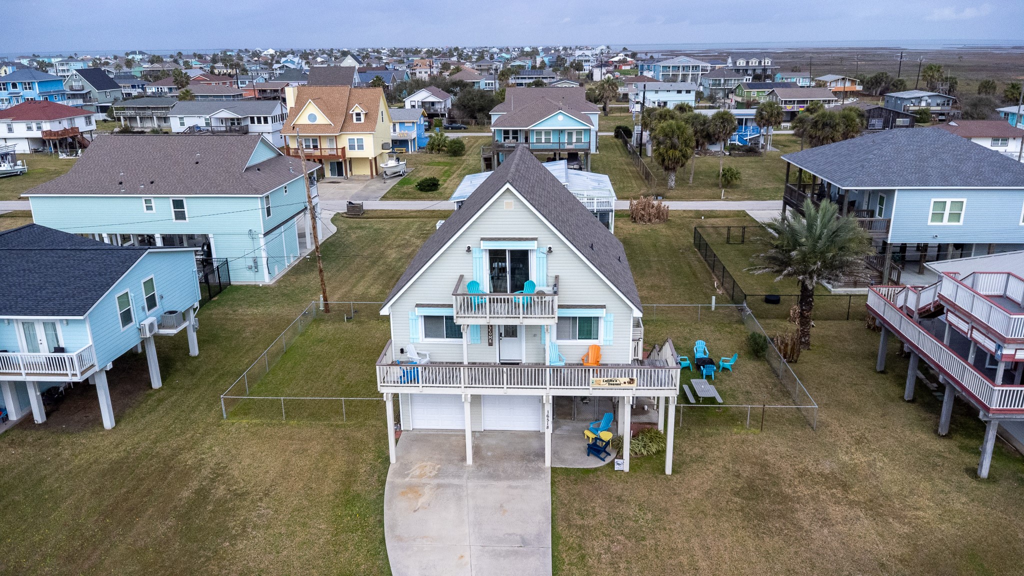16518 Jean Lafitte Road Jamaica Beach, TX 77554 - Photo 3 of 43 an aerial view of a house with a yard