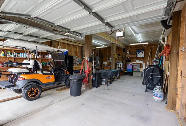 a view of a garage with cars