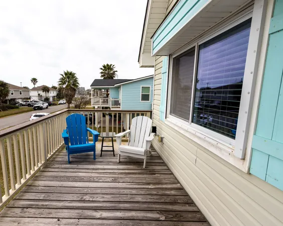 a view of a balcony with chairs