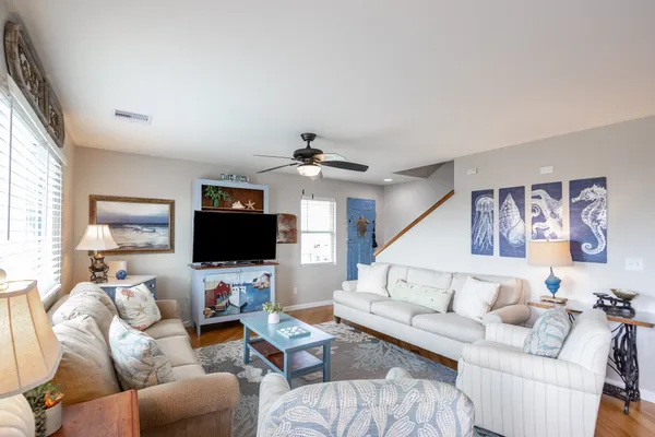 a living room with furniture and a flat screen tv