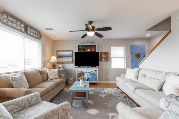 a living room with furniture and a flat screen tv