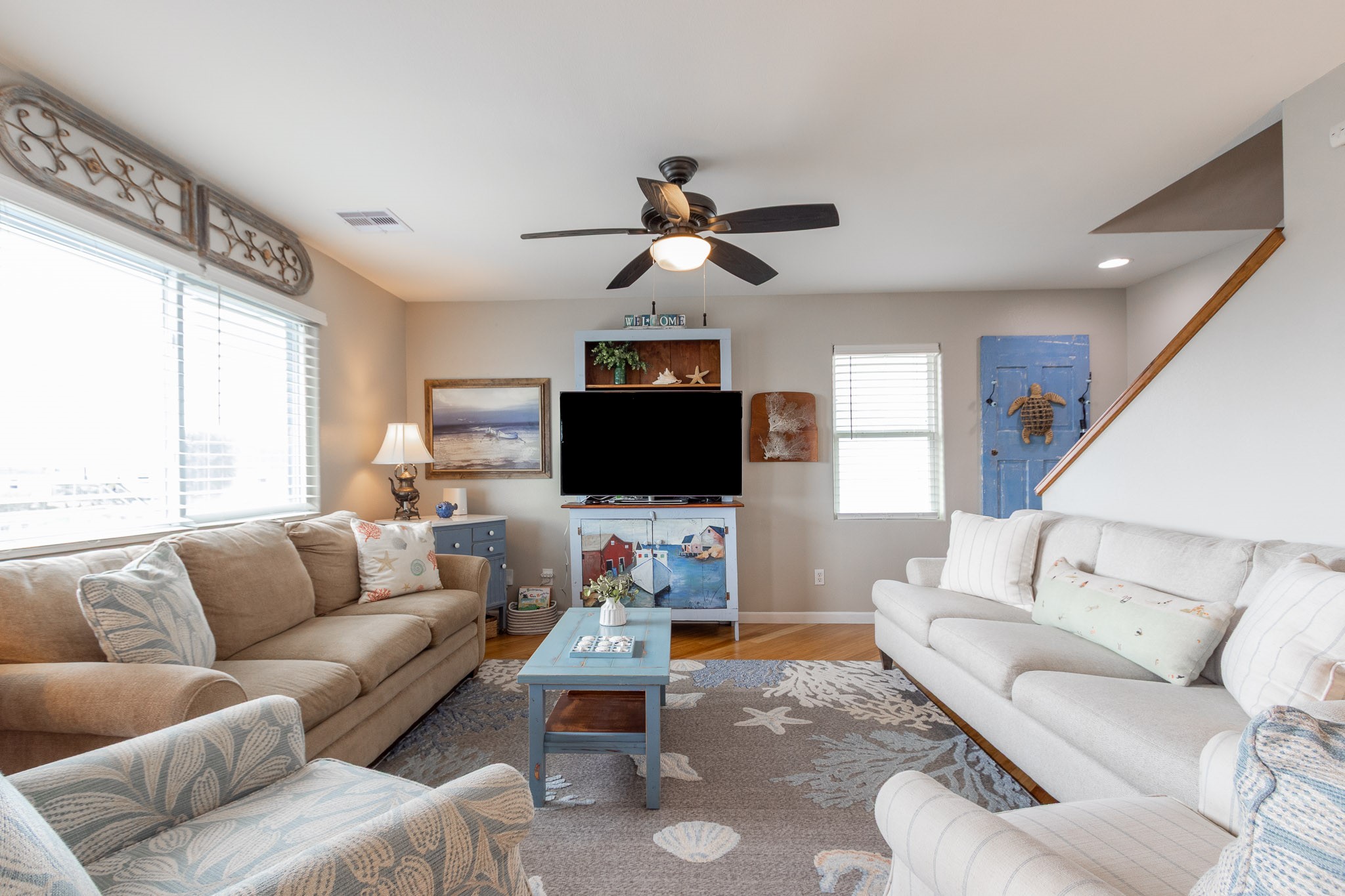16518 Jean Lafitte Road Jamaica Beach, TX 77554 - Photo 7 of 43 a living room with furniture and a flat screen tv