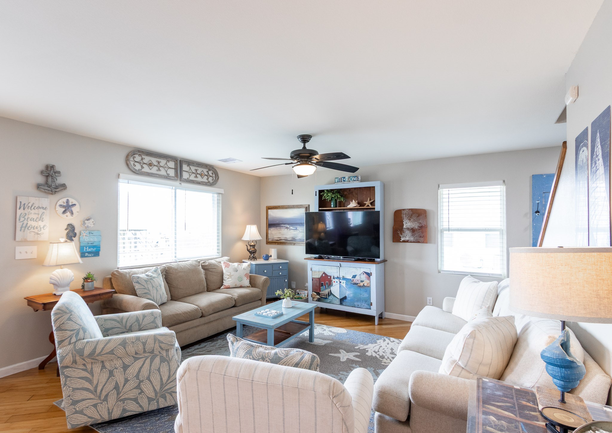 16518 Jean Lafitte Road Jamaica Beach, TX 77554 - Photo 8 of 43 a living room with furniture and a flat screen tv