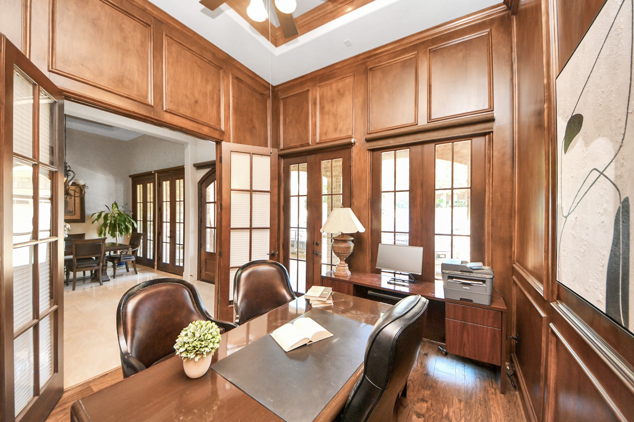 702 Fairway Oaks Conroe, TX 77302 - Photo 19 of 42 Abundant natural light from
multiple French doors. The
space includes elegant
furnishings, creating a warm
and inviting atmosphere for
work or study.