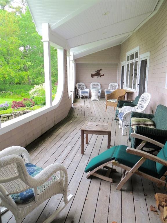 8 Tukey Lane Chamberlain, ME 04541 - Photo 12 of 20 The extensive porch offers...
