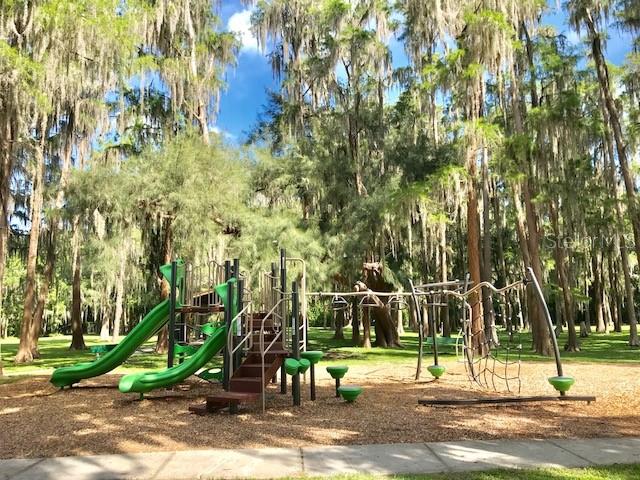 0 Purdue Street New Port Richey, FL 34654 - Photo 4 of 37 a view of a park with swings and trees