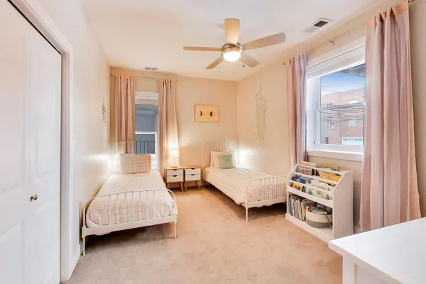a bedroom with furniture and a window