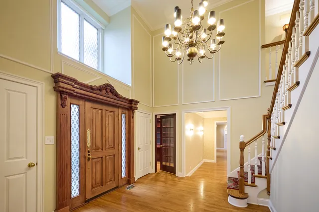 a view of an empty room with window and fire place
