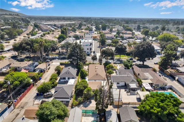 an aerial view of residential houses with outdoor space