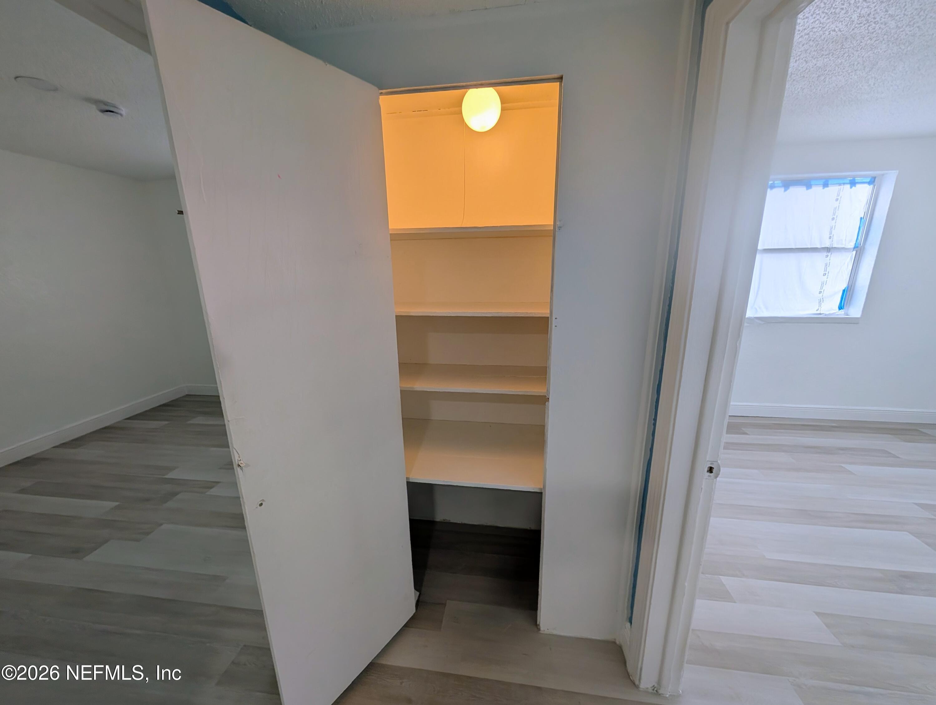 1454 Ribault Scenic Drive Jacksonville, FL 32208 - Photo 15 of 22 a view of walk in closet with empty racks