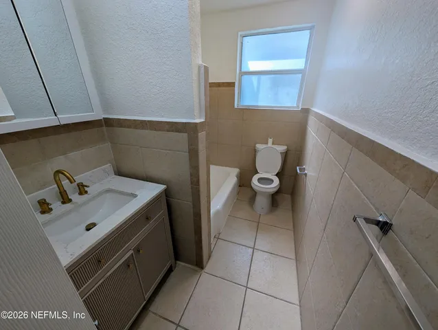 a bathroom with a sink and toilet