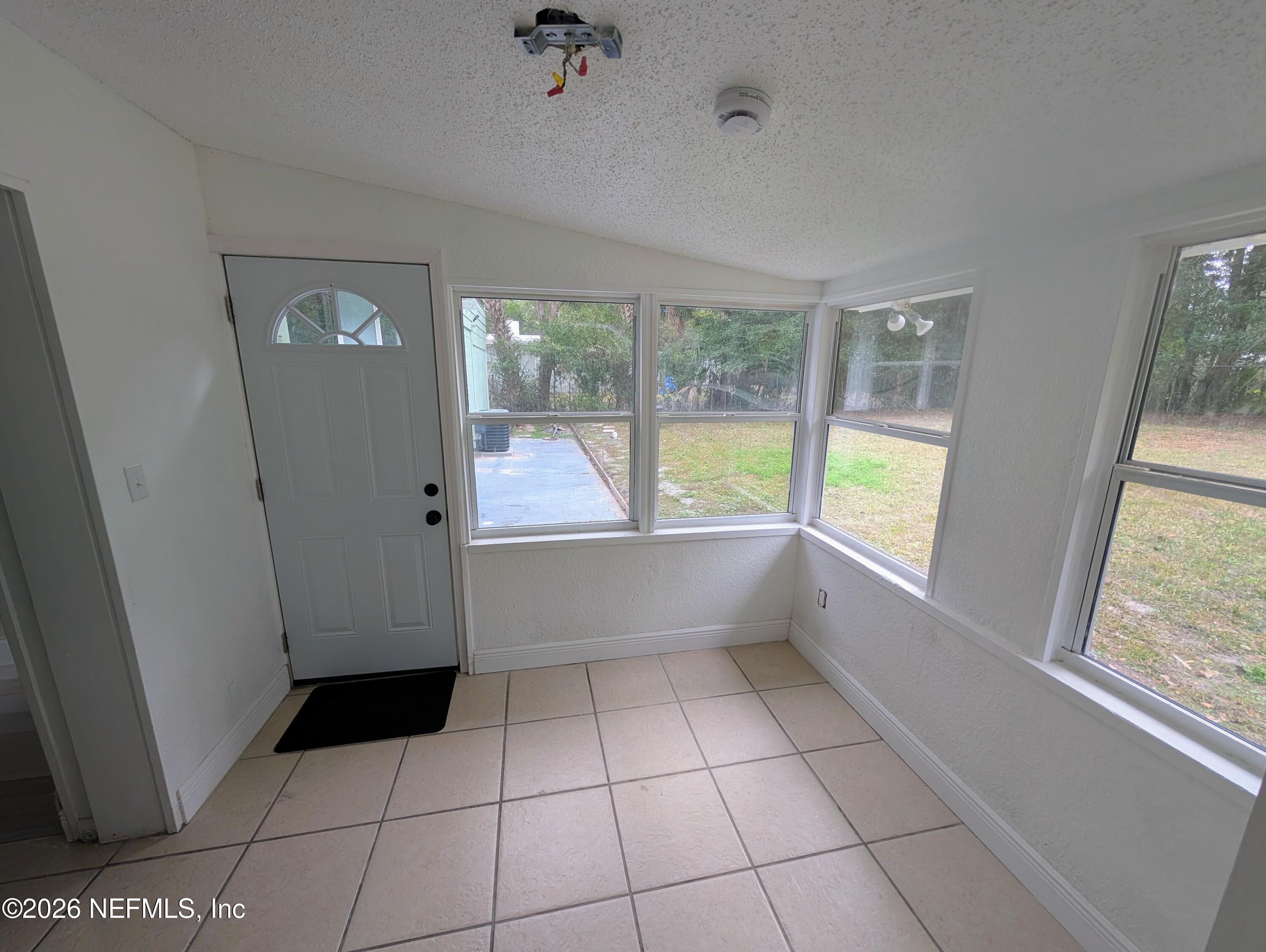 1454 Ribault Scenic Drive Jacksonville, FL 32208 - Photo 18 of 22 a view of an empty room and window