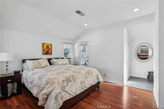 a bedroom with double bed and a window