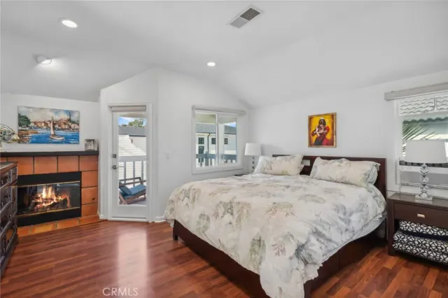 a spacious bedroom with a bed and a fireplace