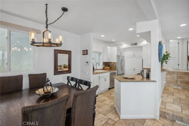 a kitchen and a refrigerator in a kitchen