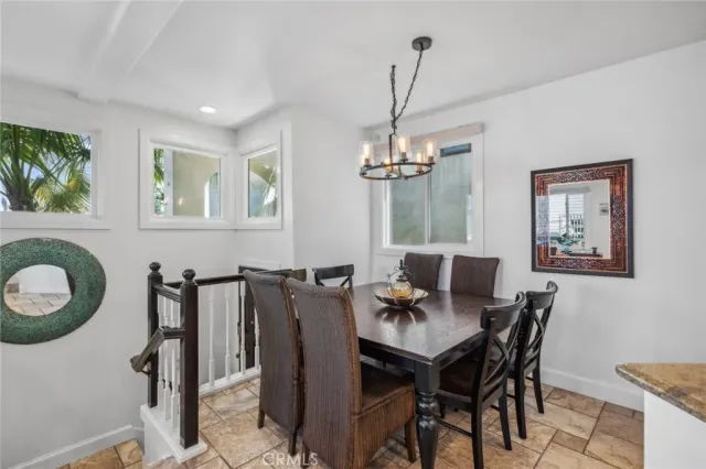 a view of a chairs and table in a balcony