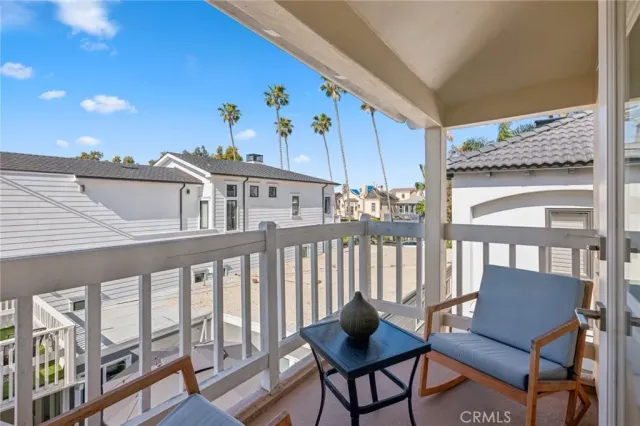 a view of a chairs and table in a balcony
