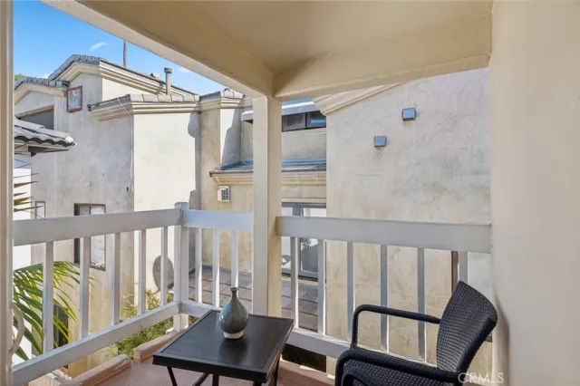 a view of a balcony with furniture