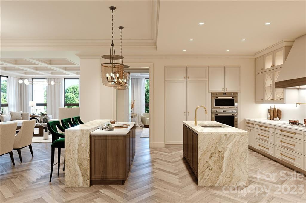 130 Cherokee Road, Unit 103 Charlotte, NC 28207 - Photo 17 of 29 a kitchen with stainless steel appliances kitchen island granite countertop a table chairs in it and a window