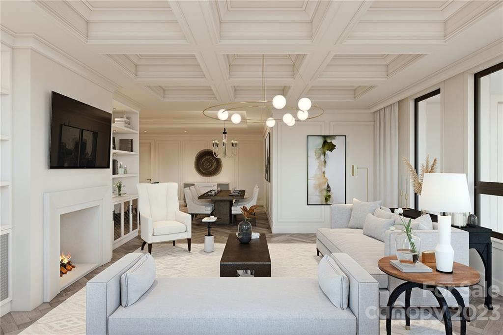 130 Cherokee Road, Unit 103 Charlotte, NC 28207 - Photo 21 of 29 a living room with furniture a flat screen tv and kitchen view