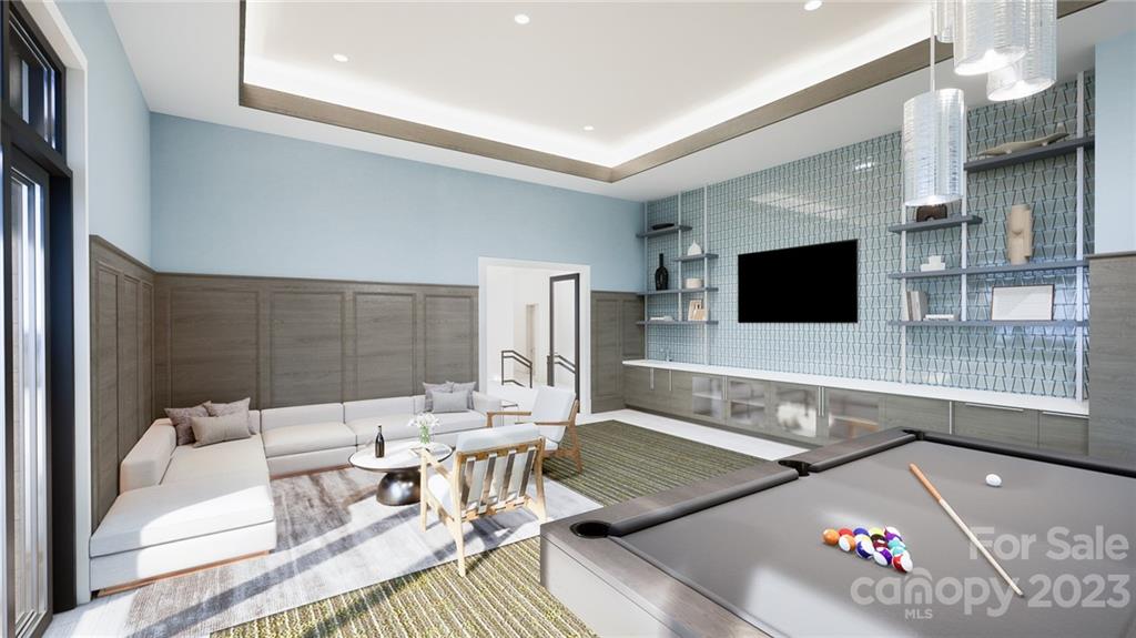 130 Cherokee Road, Unit 103 Charlotte, NC 28207 - Photo 28 of 29 a living room with furniture and a flat screen tv