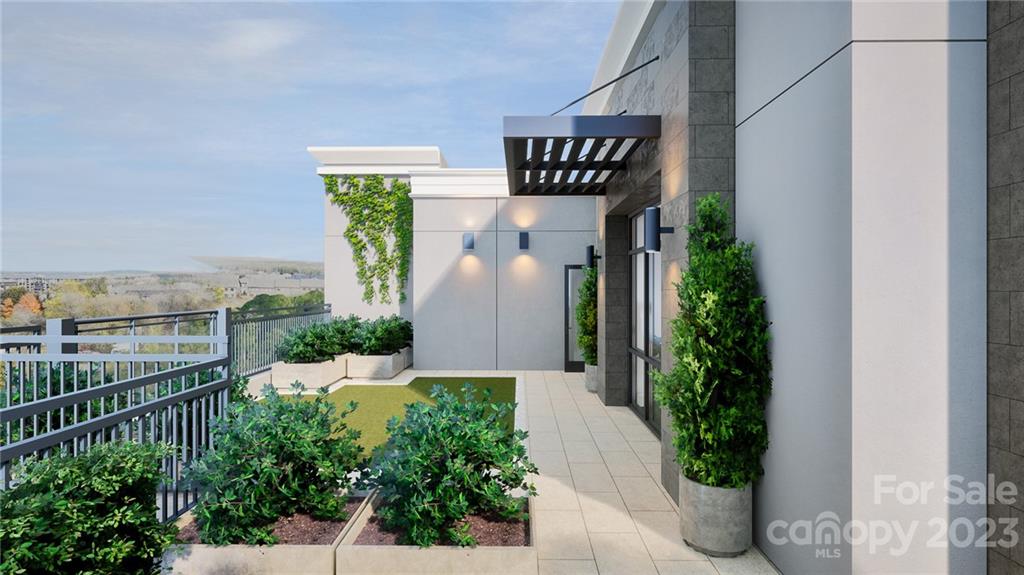 130 Cherokee Road, Unit 103 Charlotte, NC 28207 - Photo 3 of 29 a front view of a house with garden