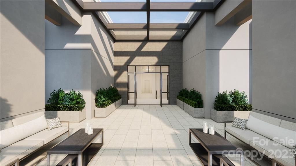 130 Cherokee Road, Unit 103 Charlotte, NC 28207 - Photo 7 of 29 a outdoor space with lots of furniture and a potted plant