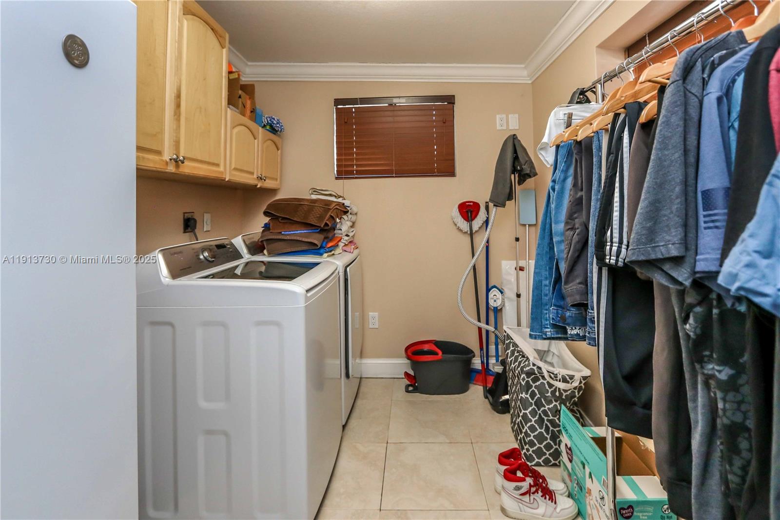 11617 Southwest 171st Street Miami, FL 33157 - Photo 11 of 23 a view of walk in closet with clothes and shoes