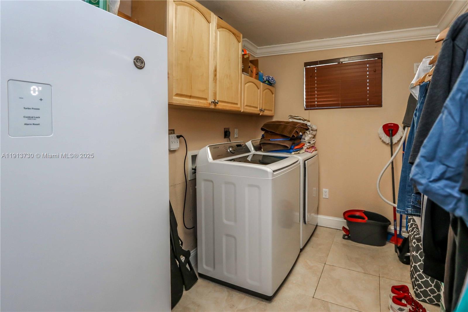 11617 Southwest 171st Street Miami, FL 33157 - Photo 12 of 23 a utility room with dryer and washer
