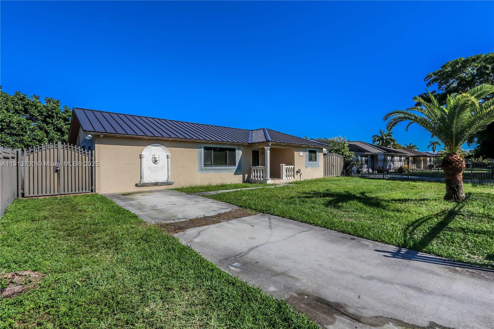 11617 Southwest 171st Street Miami, FL 33157 - Photo 19 of 23 a view of a house with a yard