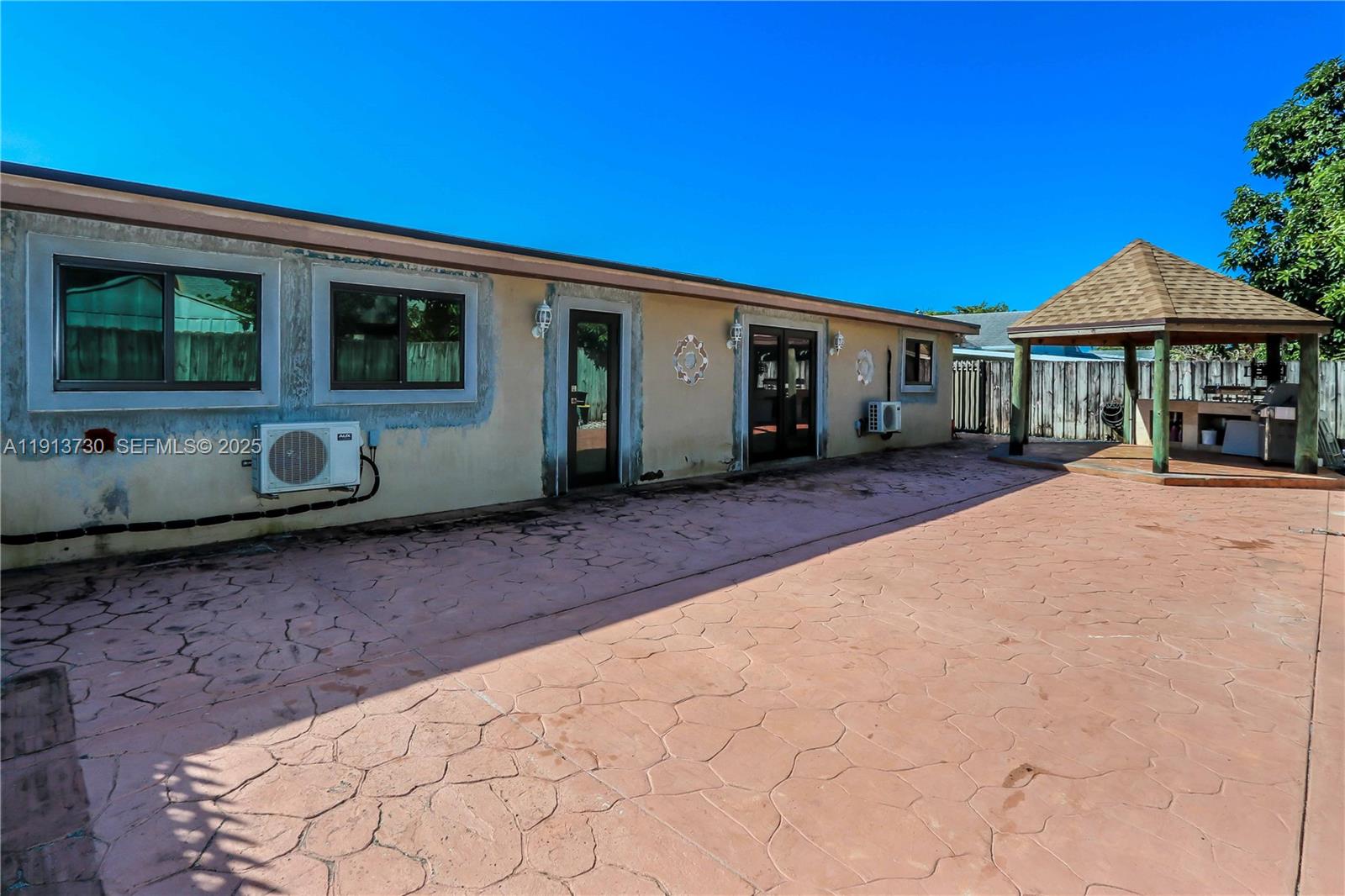 11617 Southwest 171st Street Miami, FL 33157 - Photo 9 of 23 a front view of a house with garden