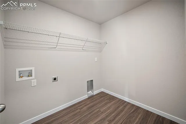 a view of a small space with wooden floor