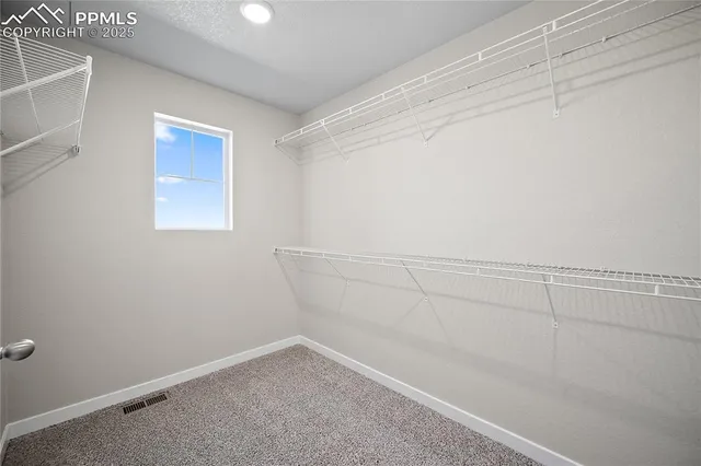 a view of a room with racks on the wall