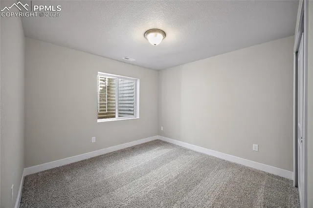 a bathroom with a granite countertop sink toilet a shower and a mirror