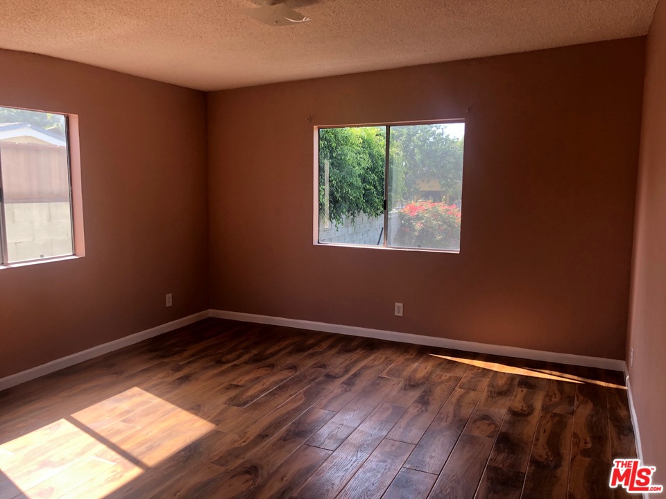 4133 Bemis Street Los Angeles, CA 90039 - Photo 4 of 13 a view of an empty room with wooden floor and a window