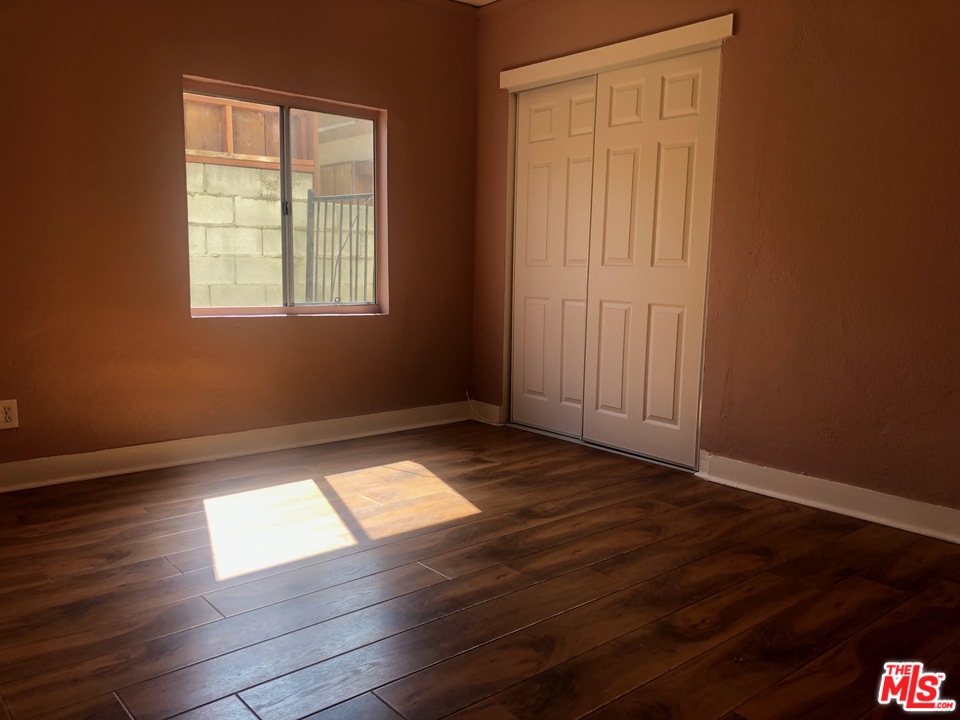 4133 Bemis Street Los Angeles, CA 90039 - Photo 7 of 13 an empty room with wooden floor and windows
