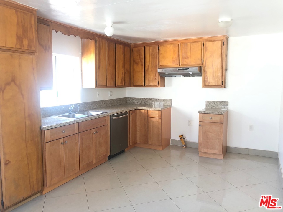 4133 Bemis Street Los Angeles, CA 90039 - Photo 9 of 13 a kitchen with a stove sink and cabinets