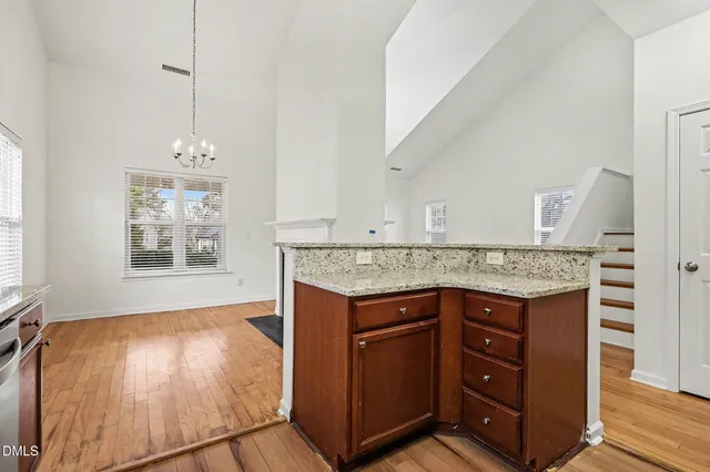a view of a kitchen with a sink and cabinets