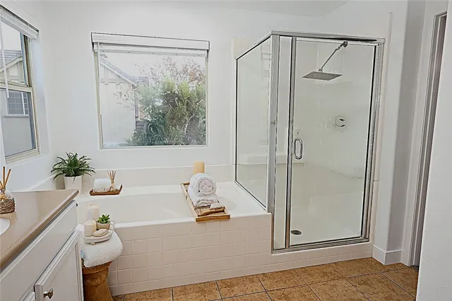 a bathroom with a shower and a tub